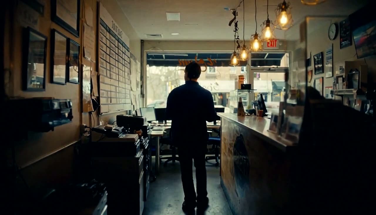 An operator moving through a service counter at trading hours.